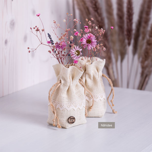 600px-button-vasenhussen-schmuckbild